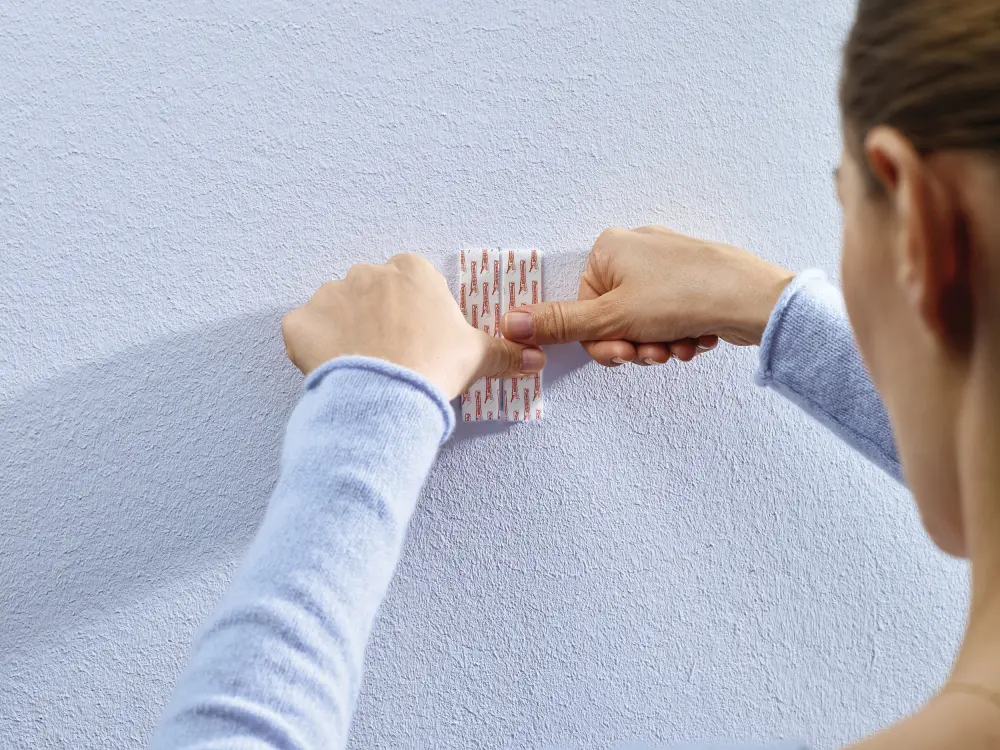 Tesa Tesa - Adjustable self-adhesive nail for all types of wall (max 2x2kg)